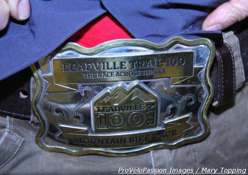 Kent Eriksen unveils his Leadville 100 belt buckle; it's larger because he and Katie completed the course in under nine hours