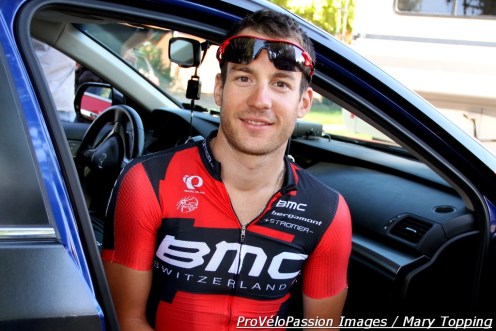 Julien Taramarcaz resting his legs in a BMC Racing Team car in Richfield, Utah