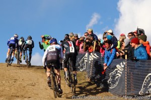 Alex Howes leans over the fencing to blast an airhorn at Danny Summerhill
