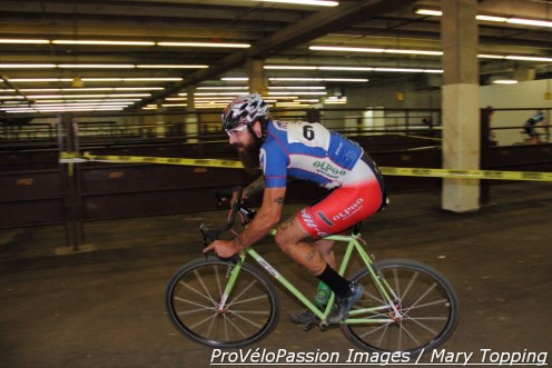 Nic Handy rolls past the stock-pens at the National Western Complex