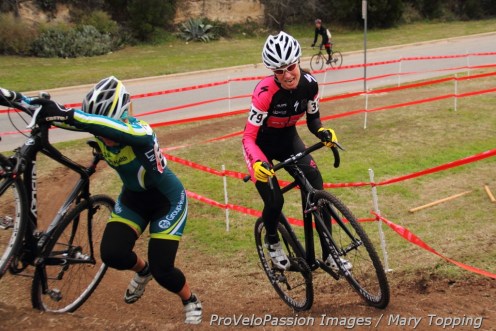 Melissa Barker passes a lapped rider while chasing Kristin Weber in lap four
