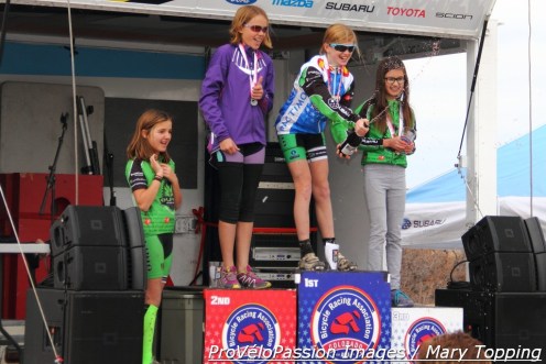 The Alpha Bicycle Company - Vista Subaru Team hopes to spray lots of bubbly during the 2015/16 'cross season. Here Lauren Zoerner sprays carbonated cider at the 2014 state champs. 